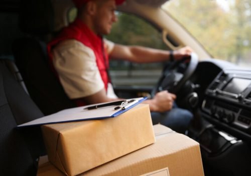 Courier,Driving,Delivery,Van,,Focus,On,Parcels,And,Clipboard